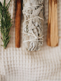 White sage bundle with Rosemary, Cinnamon, Palo Santo stick and a Selenite crystal.