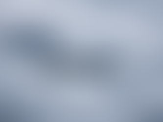 A photorealistic wide-angle view of a modern commercial jetliner flying head-on through dense fog and thin clouds, its landing lights glowing softly. Faint wingtip vortices trail from the wings as dark, rugged mountain ridgelines with lightly snow-dusted peaks emerge in the hazy background under a moody, overcast sky.