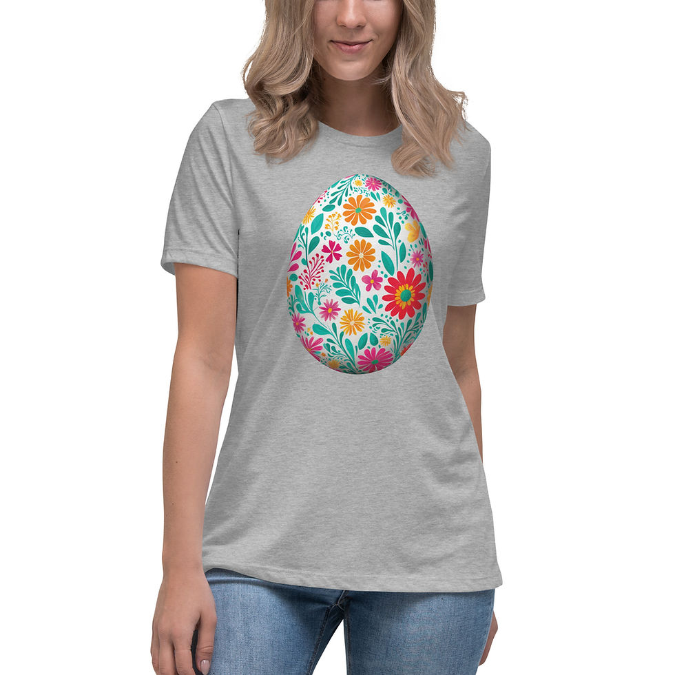 Thumbnail: Woman wearing light grey colored t-shirt featuring large white Easter egg with folk art pastel flowered print.