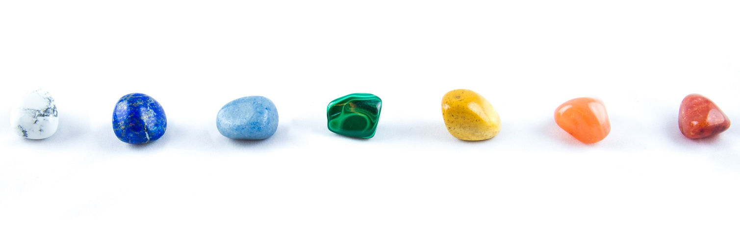 Seven chakras in a row, represented by colored stones_edited_edited.jpg