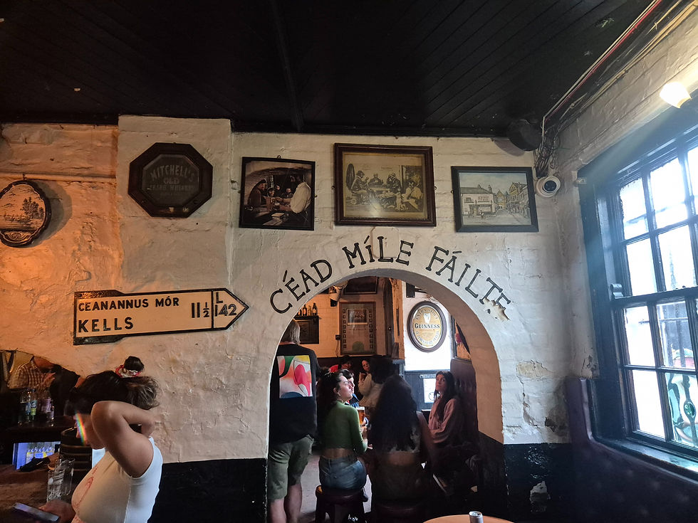 people having pints in Kelly's Cellar Belfast