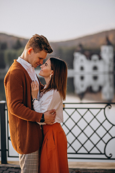 couple-love-standing-tohether-by-lake.jpeg
