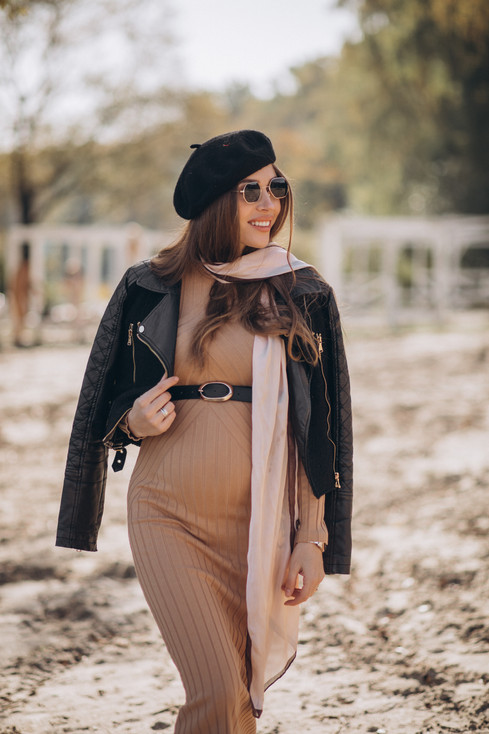 young-pregnant-woman-walking-beach.jpeg