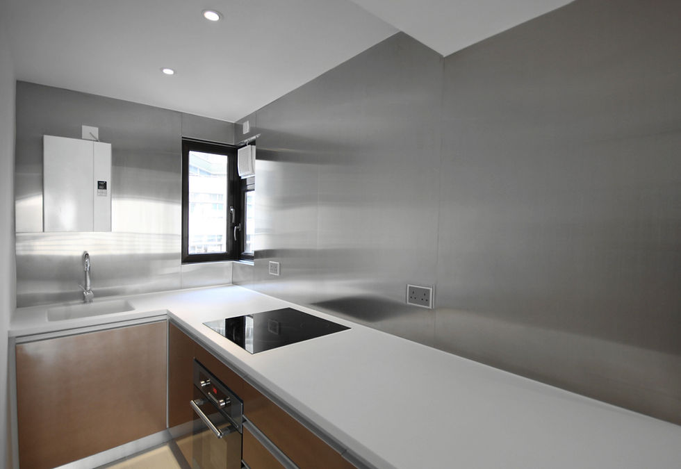 Industrial kitchen design at Bel-Mont Garden Mid-levels, featuring stainless steel wall panels