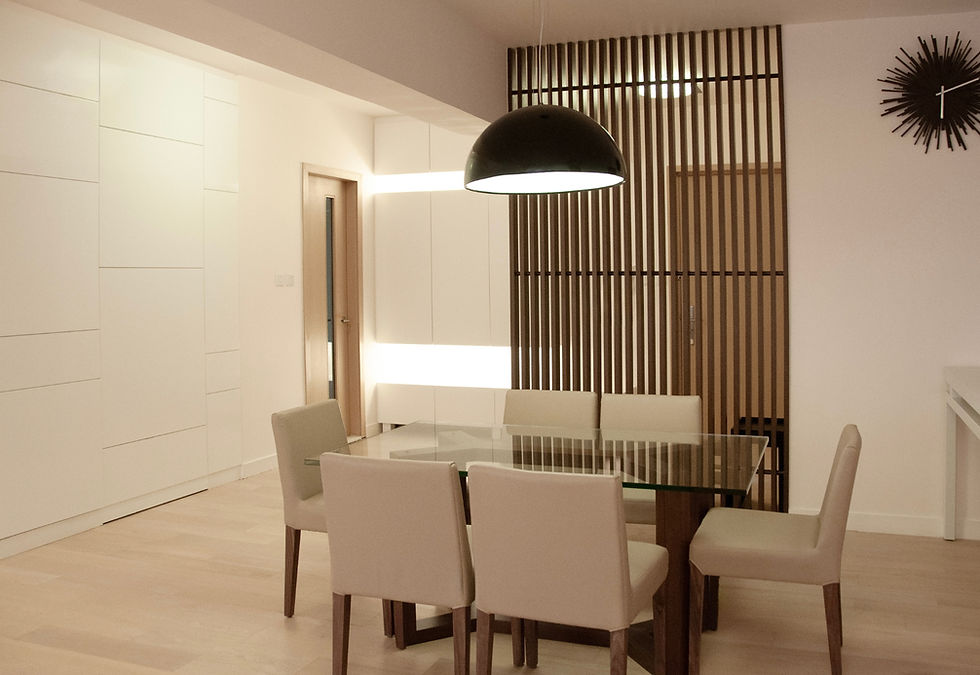 Modern dining area at Island Lodge North Point, with a wooden slat screen and white cabinets
