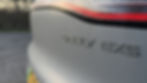 Close-up shot of the badging on the bootlid of a grey Geely EX5 Max