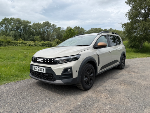 Static front 3/4 shot of a sandstone Dacia Jogger Hybrid 155