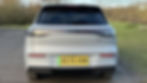 Static rear-end shot of a grey Geely EX5
