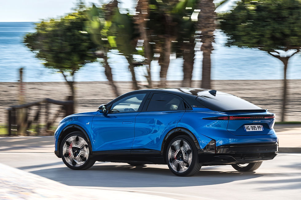 Alpine A390 GT dynamic rear three-quarter view with fastback styling and tail lights