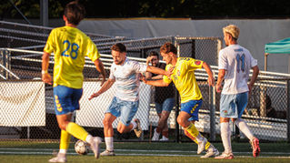 Rui Reis (center) and Enzo Dagatti (right) clash with RKC players in the midfield. Credit: Nicholas Balabanoff