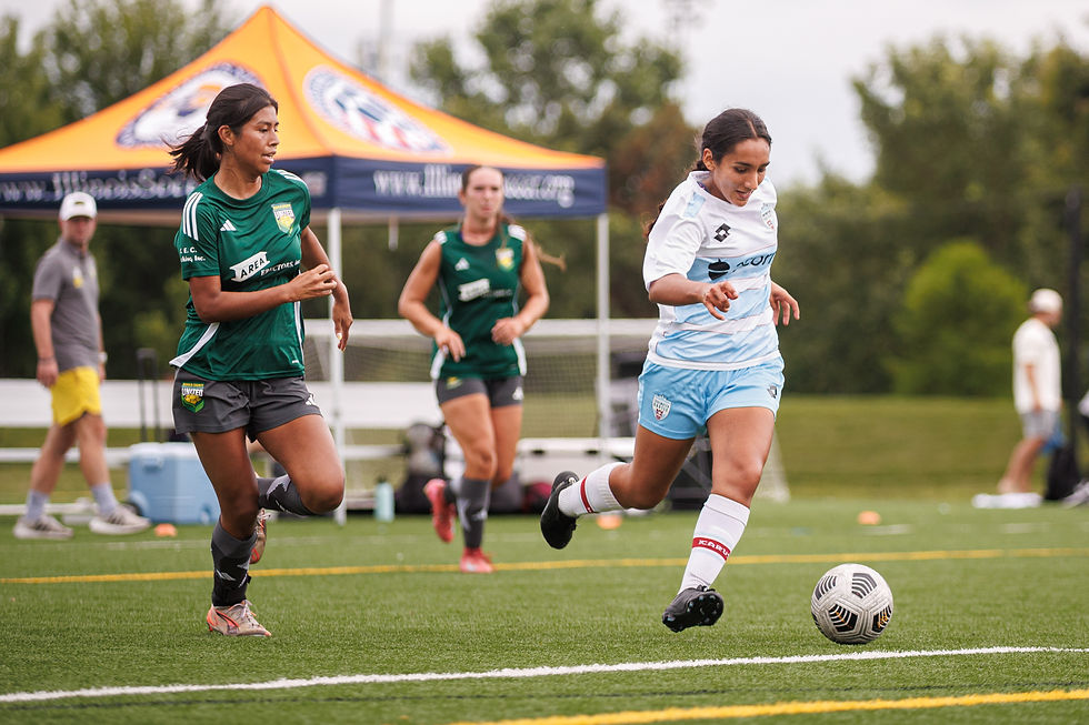 Carolina Carreon keeps the ball away from DeKalb County United's players. Credit: Nicholas Balabanoff