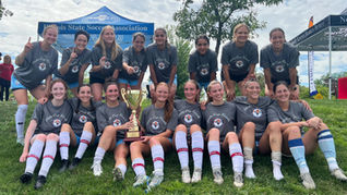 The Women's First Team poses with the Flo Dyson Cup. Credit: Tyler Navas