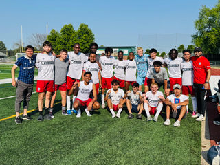 Men's U23 coach Al Stankovic (left) with the 2025 Men's U23 Squad. Credit: Tom Arnison