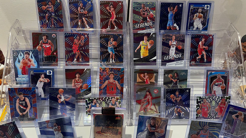 Eye-level view of a sports card collection laid out on a table for evaluation