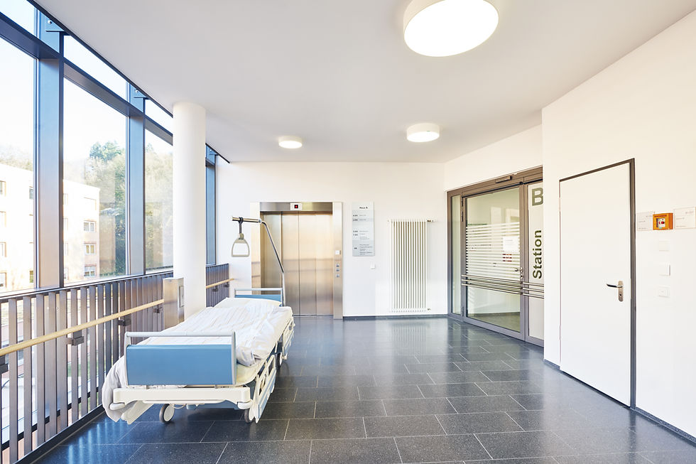 Corridor hospital empty elevator and glass door closed with bed.jpg