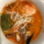 spicy chicken ramen with mushrooms, egg, bamboo shoots in a dashi broth