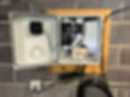 Close-up view of a GNSS receiver and antenna setup on a rooftop