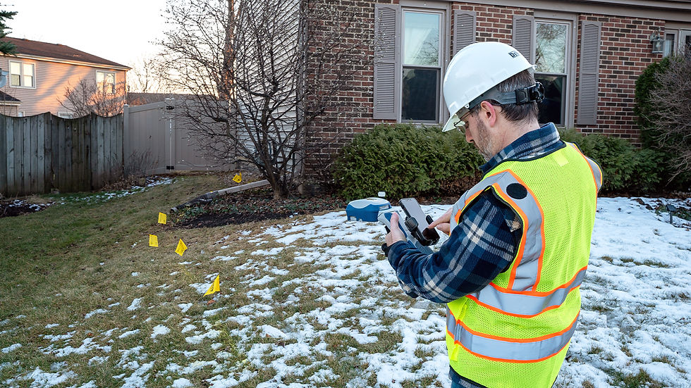Close-up view of a GPS rover receiver mounted on a surveying pole in a construction site