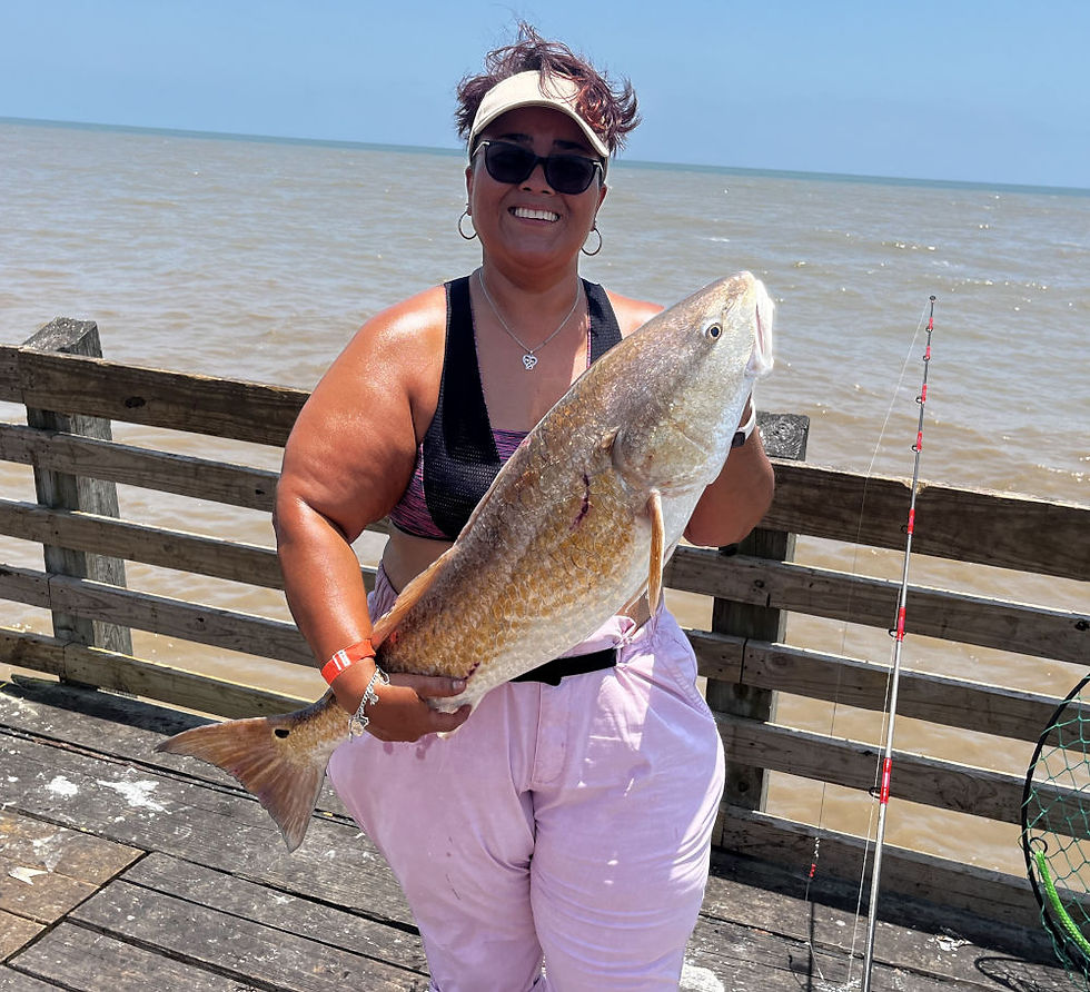 Sol pier fishing the Gulf with a Bull red drum with her VegaUSA fishing rod and her fish finder HD rig