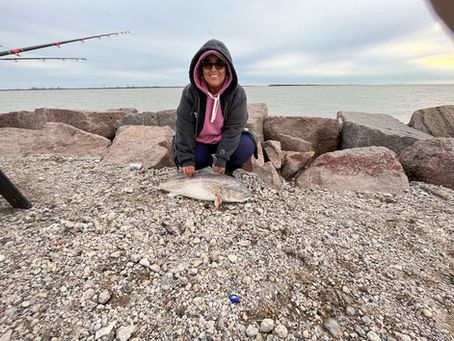 Sol winter fishing red drum fish at the texas City Dike
