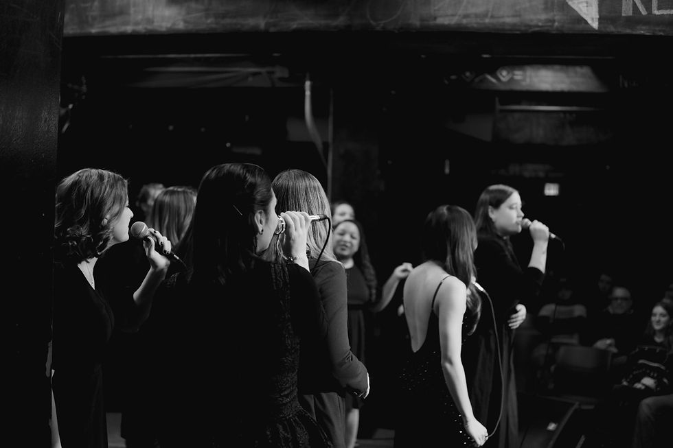 Black and white photo of live performance by Twin Cities Treble