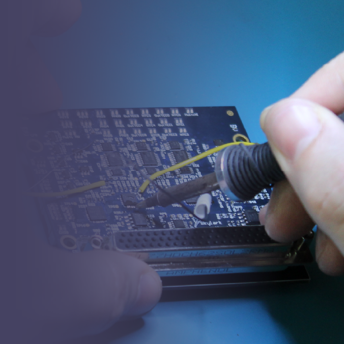 Engineer soldering laser control PCB