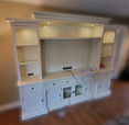 Assembling an entertainment center with bookcase, open shelves and drawers glass