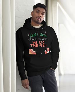A man wearing the "Winter Vibes, Music Thrives" UCS Hoodie