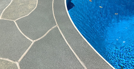 Close-up of the RenuKrete surface with the pool visible alongside