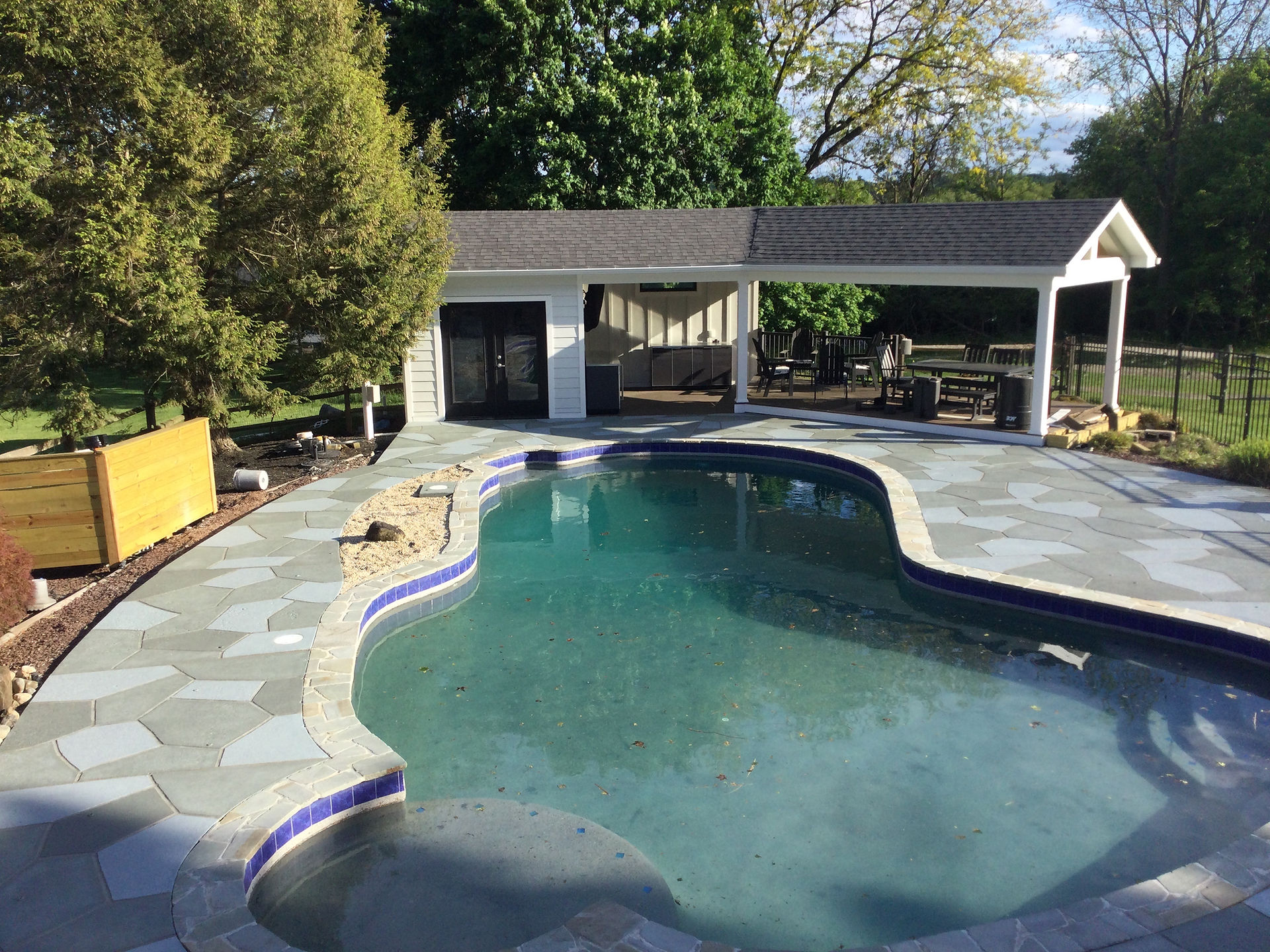 RenuKrete resurfaced pool deck blending decorative concrete with a stone appearance