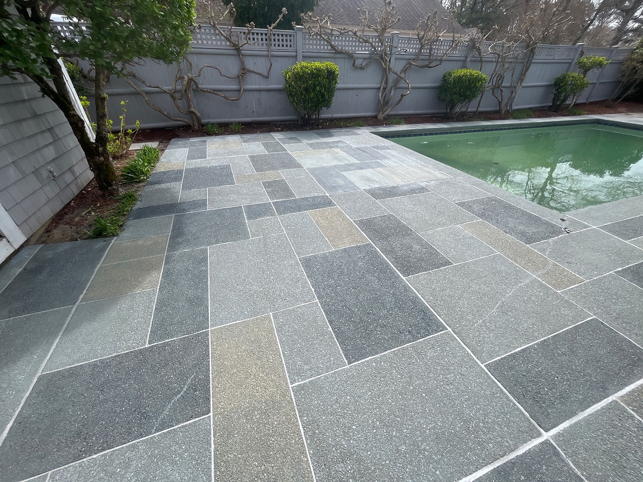 RenuKrete pool deck finish that turns aged concrete into a natural stone look surface