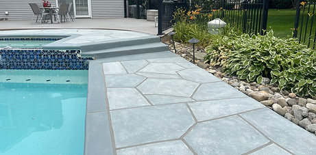 Granite Boulder surface running alongside the pool with defined flagstone pattern