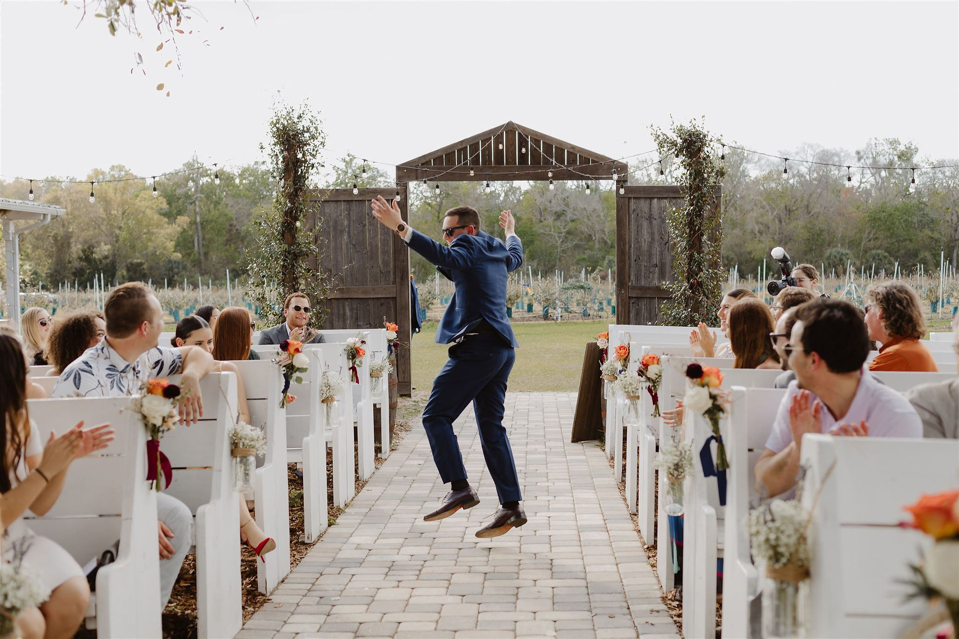 Excited groom down the aisle