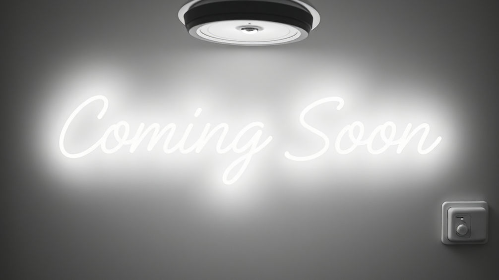 Neon white light saying 'Coming Soon' at