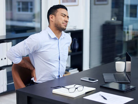 Businessman with back pain from bad posture
