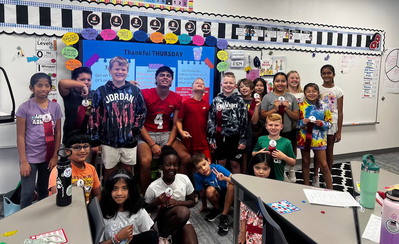 Xavier Sanchez volunteering with elementary school students