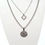 Miniature : Un collier en acier inoxydable à 2 rangs et pendentifs. Une chaine plus fine avec un losange et 1 plus large avec un mandala