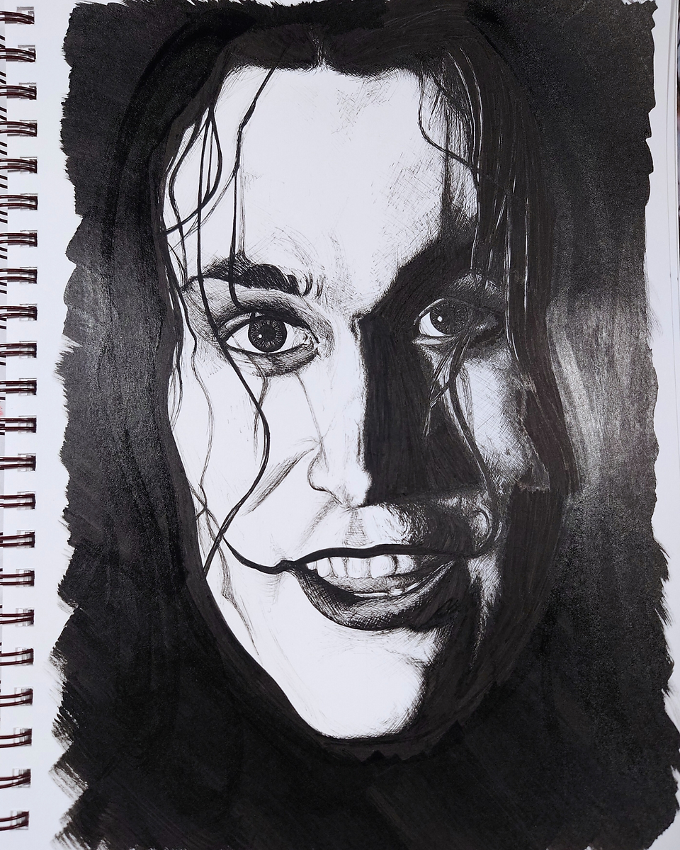A black and white portrait of Brandon Lee as The Crow.