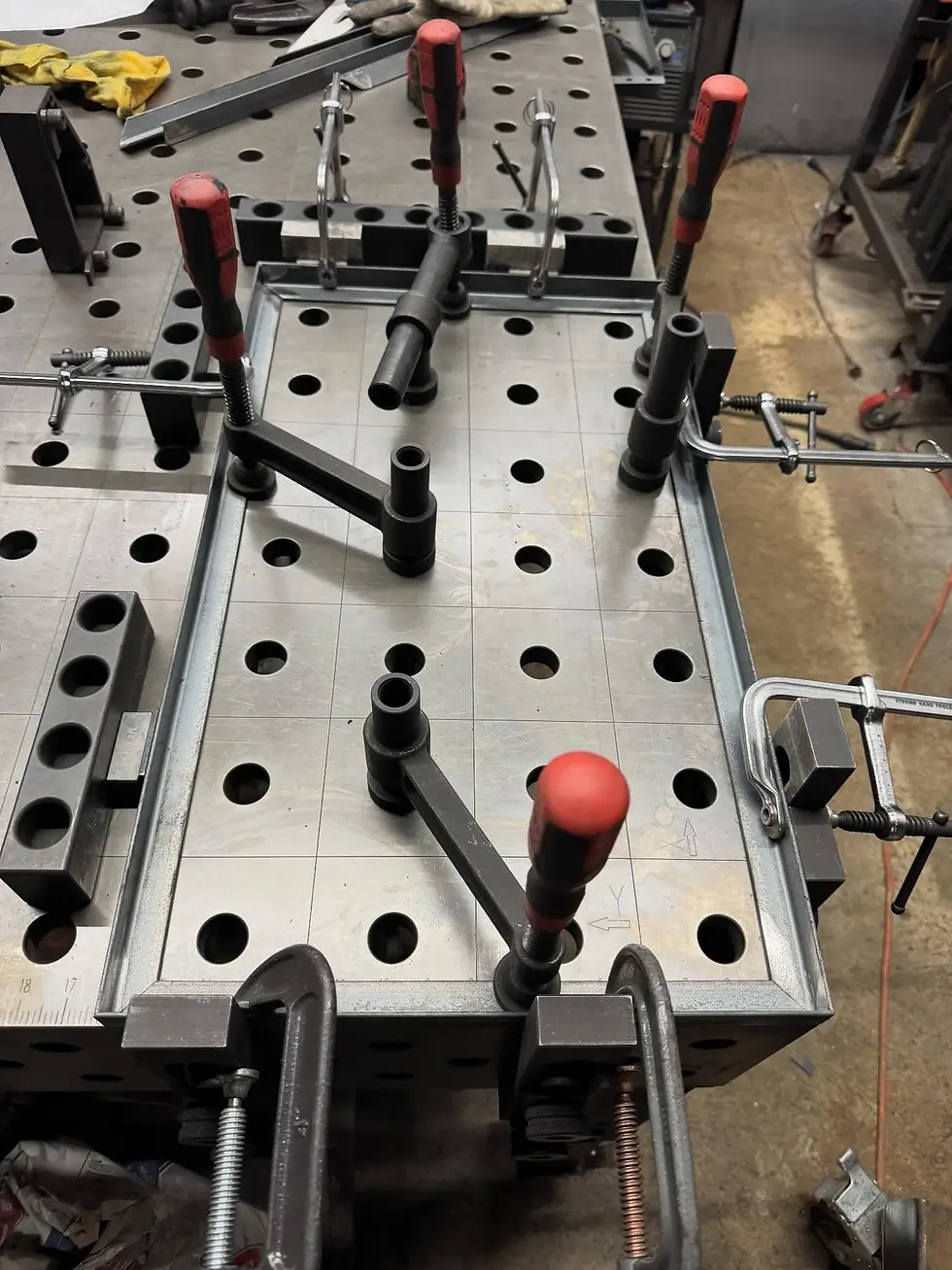Nitrided welding table surface with modular clamping accessories
