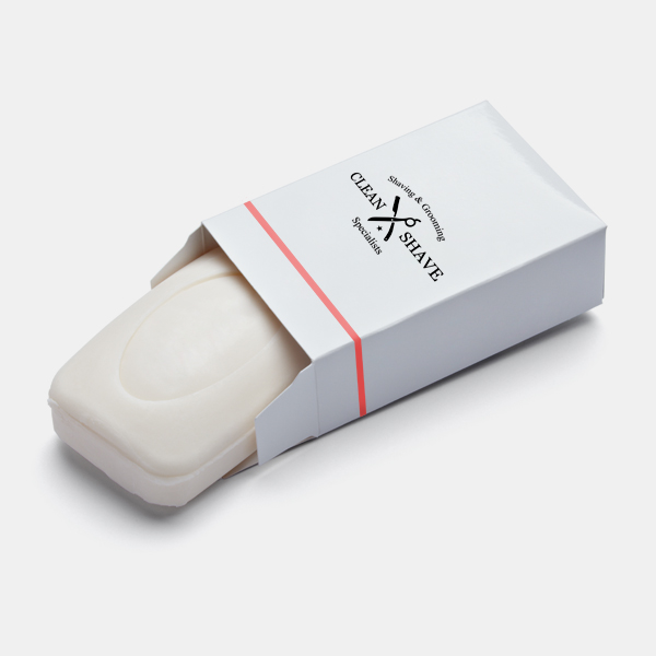 Shaving soap bar with red stripe