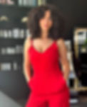 woman standing with curly hair