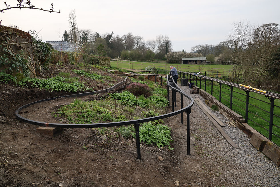 Meanwhile, Johnnie has not spring blossom on his mind but the model railway instead – seen here hard at work on some major track improvements.