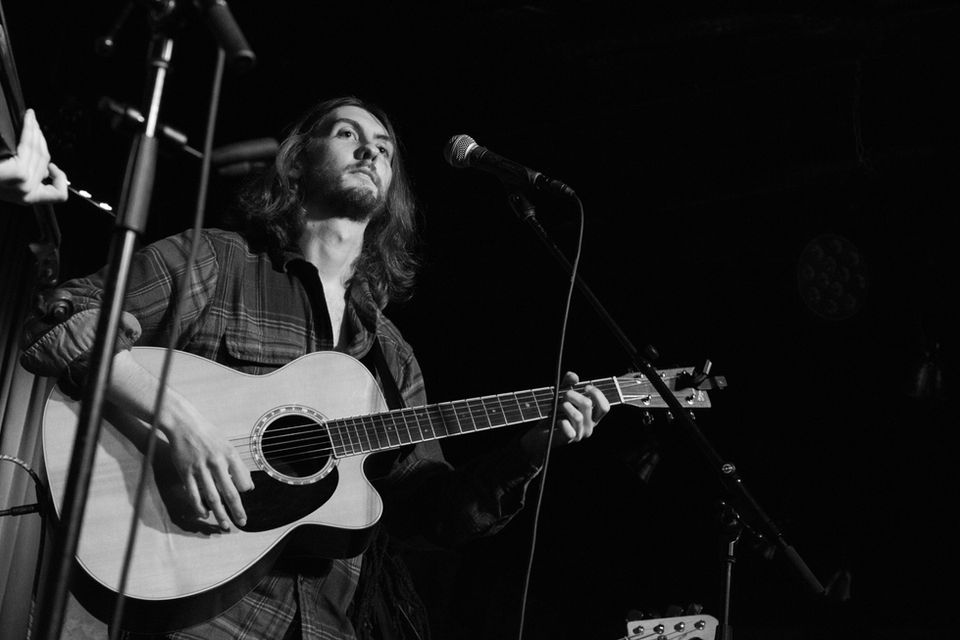 Digital black and white photograph of a guitar player at the Crowbar in Ybor