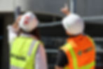 Construction engineers inspecting a site installation