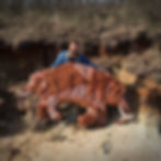 Picture of the American artist Joshua Goode and of his Headed Mastodon Mummy.