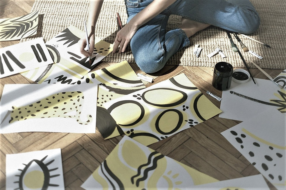 Artist at work painting lines and shapes