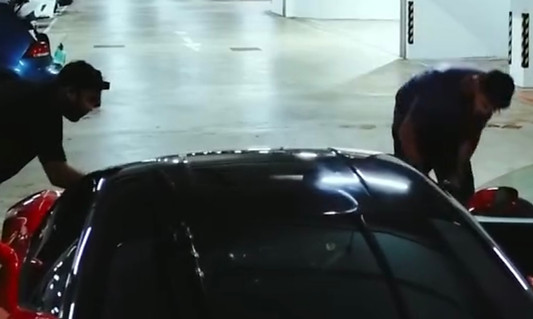 Automoto detailing team detailing a Ferrari hyper car