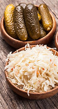 sauerkraut-pickled-cucumbers-tomatoes-wooden-bowls_290431-3772_edited.jpg