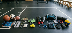 A line up of exercise equipment on a gym floor