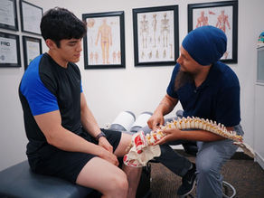 A man getting spinal advice from a chiropractor